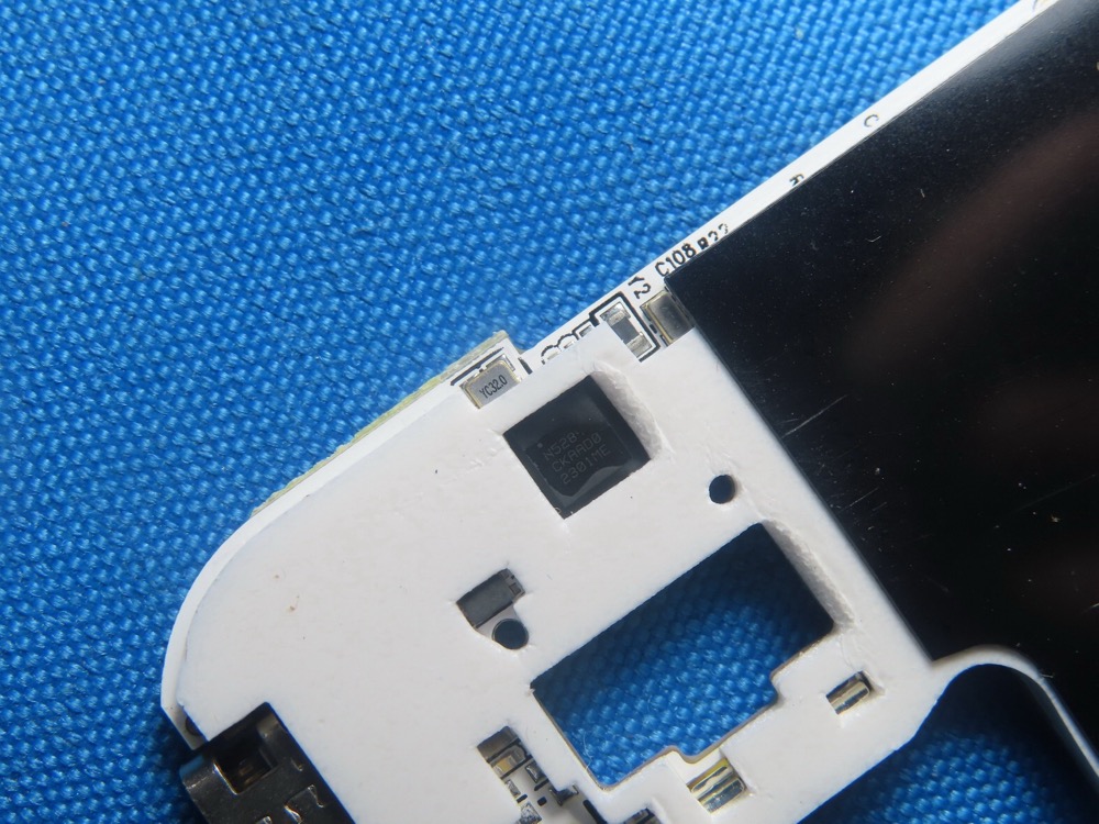 nRF52811 SoC close-up, marking N52811 / 2301ME (FCC exhibit)